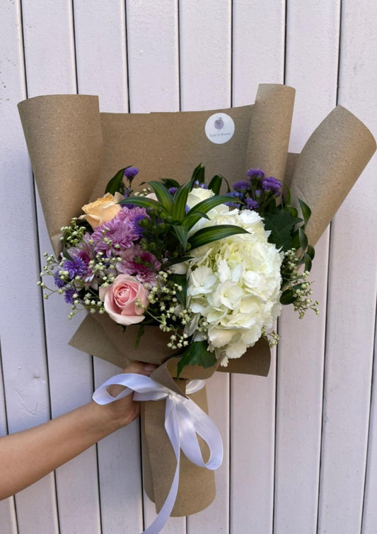 White Hydrangea, Pink Rose, Peach Rose, Kamini, Baby's Breath, Pink Chrysanthemum, Blue Daisy