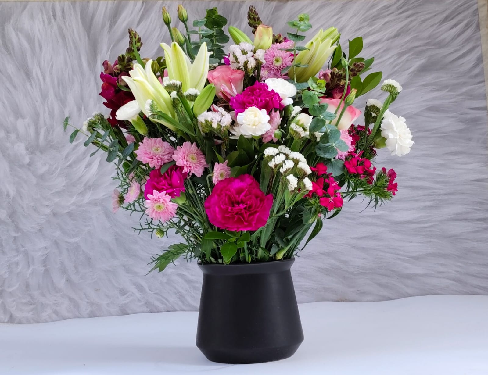 Exotic orchids and anthuriums in a luxurious bouquet for home decor.