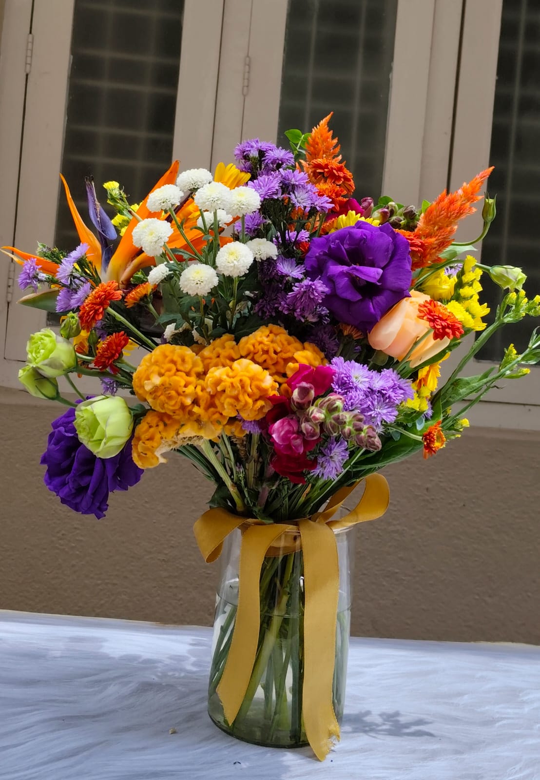 Curated flower subscription box showcasing 10–12 premium fresh flower stems ready for delivery