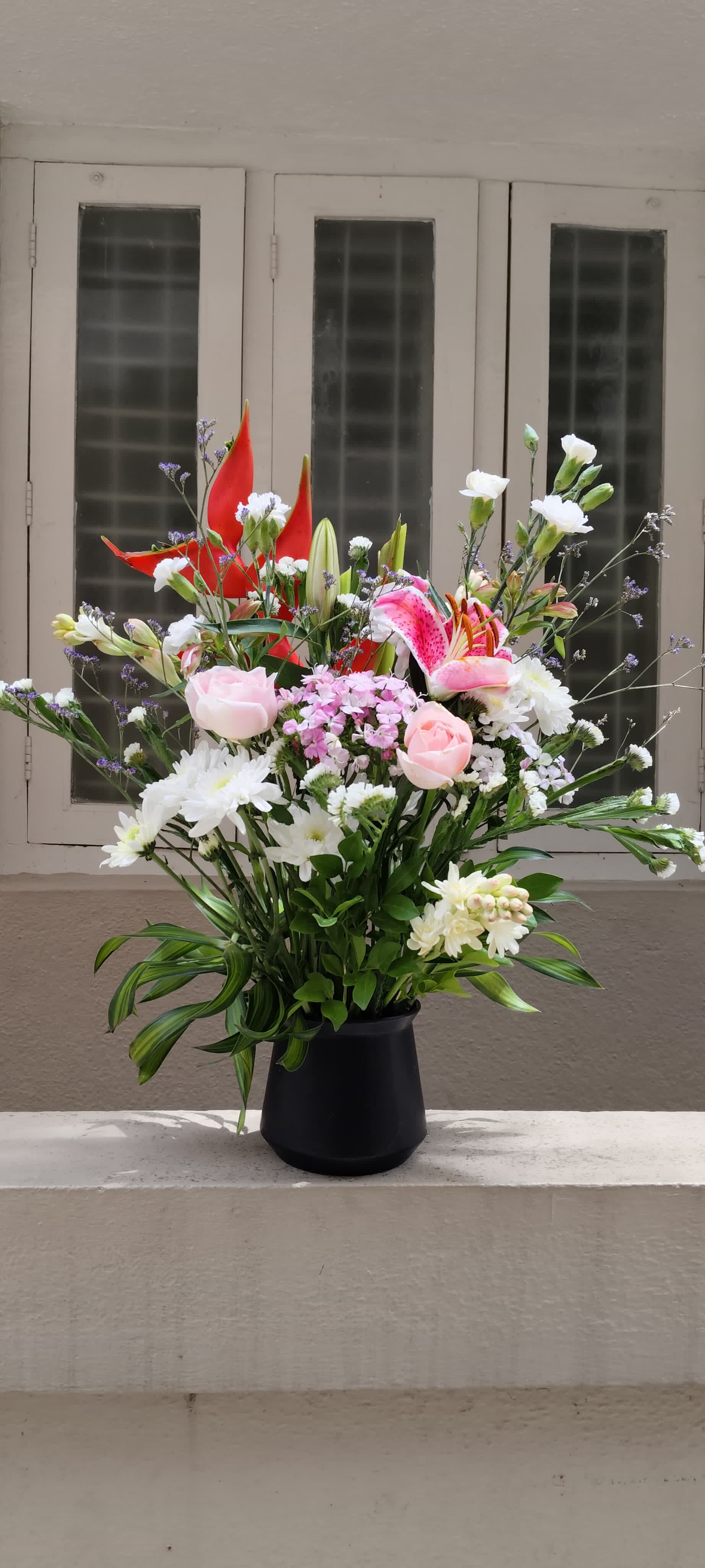 Fresh, hand-arranged exotic flowers in a modern living room, perfect for home decor