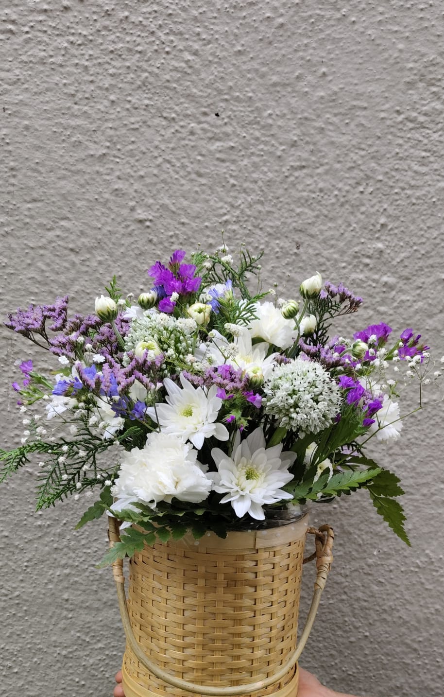 Seasonal flower arrangement with marigolds, roses, and gerbera in a cozy office or home setting, perfect for Everyday Bloom subscribers by Buds and Blooms